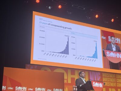 Orlando Bravo (Thoma Bravo) on stage at Sohn New York 2026, with 25-year revenue and EBITDA growth chart in the background